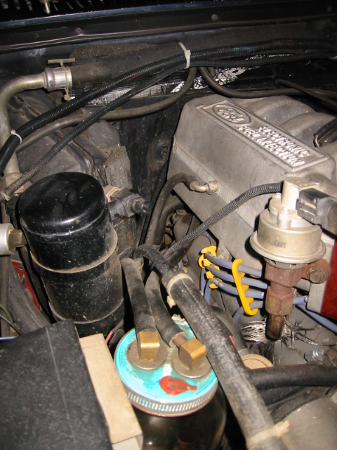 1985 Ford Bronco - Close-up view of the engine bay, showing the Ford V8 engine and various components.