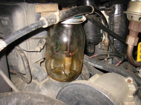 1985 Ford Bronco - Homemade fuel filter made from a glass jar is visible in the engine bay.