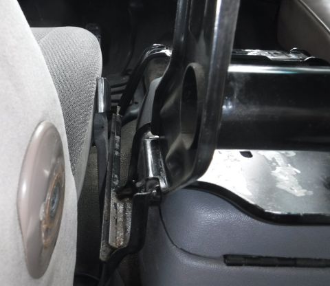 1992 Ford Bronco - Not enough room to keep the driver's seat armrest, but the folded-down jump seat has padded edges to fill that role, assuming it doesn't en…
