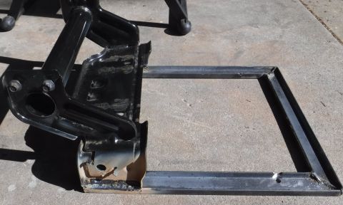 1992 Ford Bronco - Rear upright welded to the new c-channel base. The F-series 40/20/40 bracket doesn't have the 4 mounting holes square, so I had to make som…