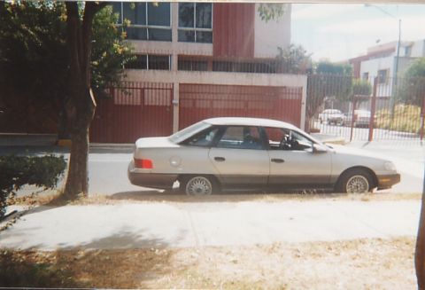 1991 Ford Taurus - This 1991 Ford Taurus is seen parked curbside on a sunny day.