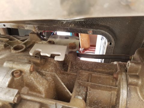 1978 Ford Bronco - The interior of an older vehicle shows worn seats and a view of the roof lining.