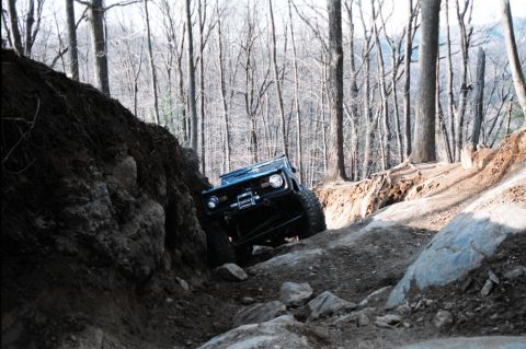 1976 Ford Bronco - Off-roading in a 1976 Ford Bronco on a challenging, steep, and rocky path.