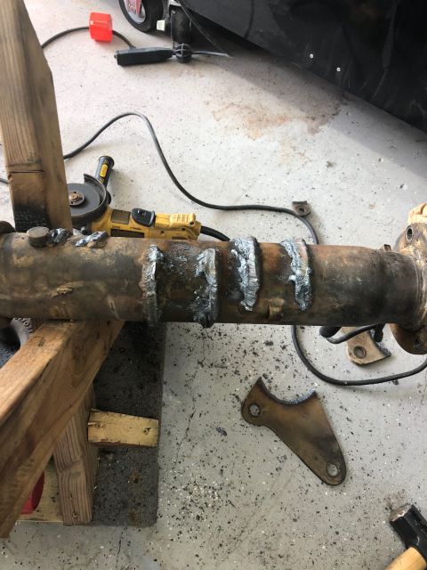 1992 Jeep Wrangler - Axle housing undergoing repair with a grinder and welding.