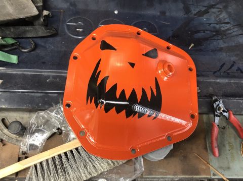 1992 Jeep Wrangler - This custom differential cover features a spooky jack-o'-lantern design for Halloween.