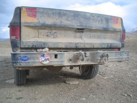 1981 Ford Bronco - This Chevrolet pickup truck, seen from the rear, features a heavy-duty aftermarket bumper and various stickers.