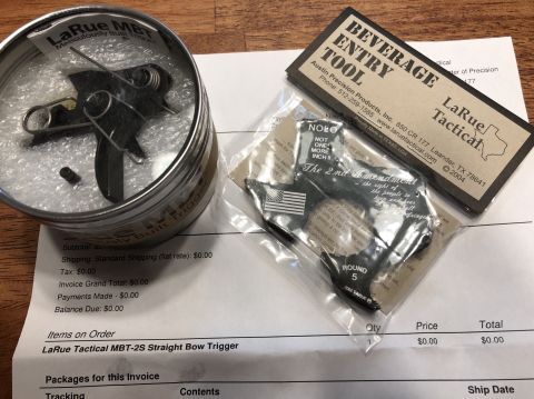 1995 Mercury Grand Marquis - LaRue Tactical MBT-2S Straight Bow Trigger shown in its tin and packaging, alongside an invoice from SuperMotors.