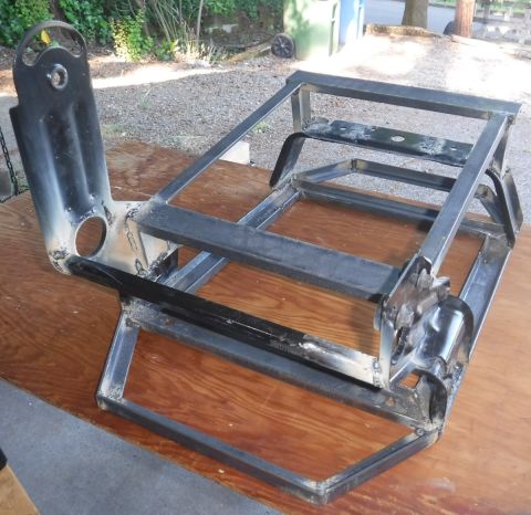 1992 Ford Bronco - Rear cross-brace tubing removed for hinged seat base clearance, new brace added further back with repurposed original front-to-back brace.