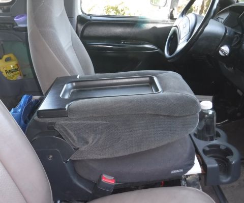 1992 Ford Bronco - Seat back folded down...a little higher than ideal as an elbow rest, but plenty comfortable. Nice sized storage tray on top in that configu…
