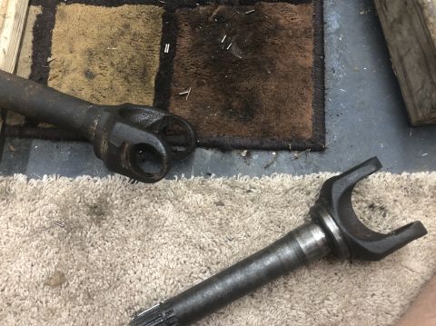 1995 Ford Bronco - Close-up of driveshaft components, suggesting a repair or maintenance task.