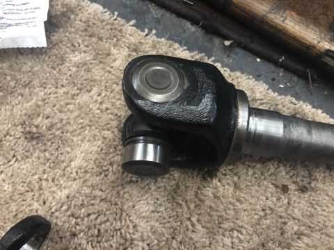 1995 Ford Bronco - A close-up view of a vehicle's driveshaft U-joint, with a Supermotors.net watermark visible.