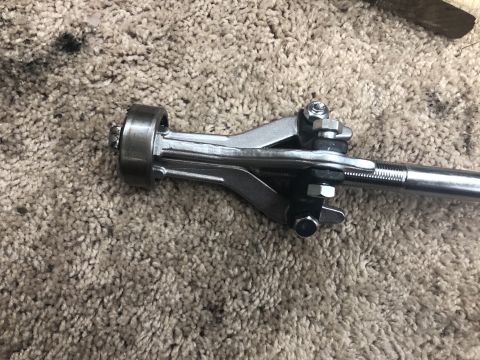 1995 Ford Bronco - Close-up of a tie rod end and adjustment sleeve, likely part of a steering or suspension repair, with the Supermotors.net logo in the corne…