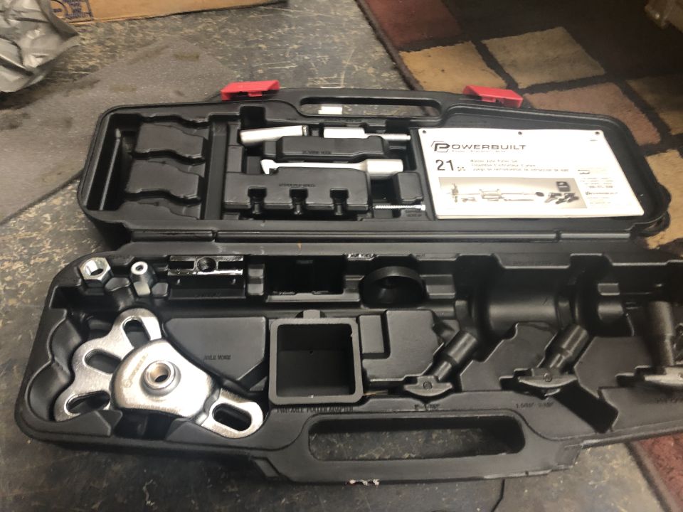 Powerbuilt 21-piece brake caliper tool kit in a black case