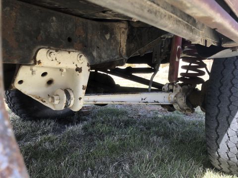 1978 Ford Bronco — Undercarriage view showing suspension components and frame of a vehicle