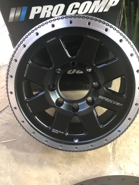 1992 Jeep Wrangler - A Pro Comp beadlock wheel is shown, a black center with a silver outer ring and visible text indicating "PROCOMP USA.COM BEADLOCK".