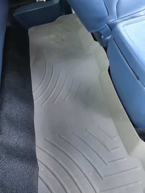 1995 Ford Bronco - Interior view of a vehicle's floor mat and seating area.