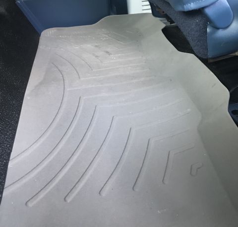 1995 Ford Bronco - Close-up of a gray WeatherTech floor mat with a textured pattern.