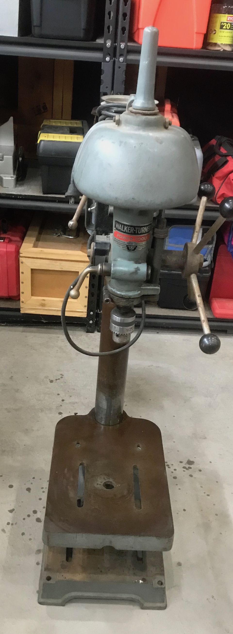 Delta drill press with a metal base and adjustable table