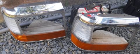 1992 Ford Bronco - The chrome was peeling on my original headlight bezel, so I replaced that, as well, while the battery tray was out.