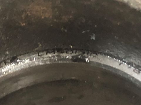 1995 Ford Bronco - Close-up of a brake rotor showing the part number "LM60700" stamped into the metal.