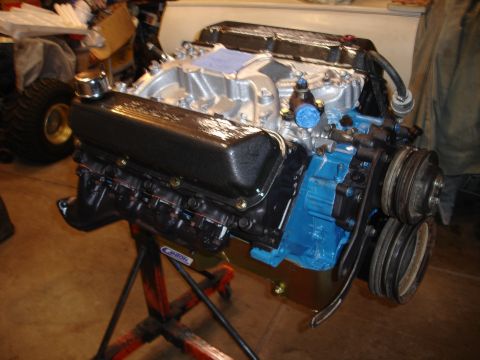 1978 Ford Bronco - Engine assembly on a stand, showing the intake manifold, valve covers, and block.