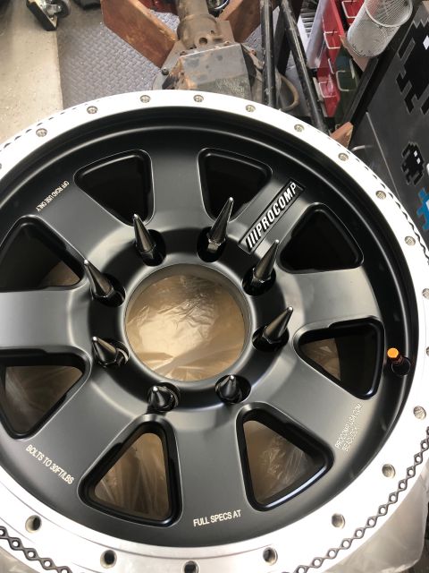 1992 Jeep Wrangler - Pro Comp wheel with spike lug nuts and "OFF ROAD USE ONLY" text visible.