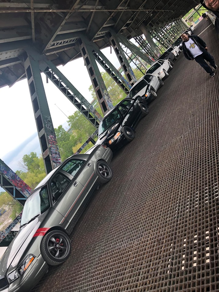 Gray 2004 Ford Crown Victoria and other sedans parked on a bridge