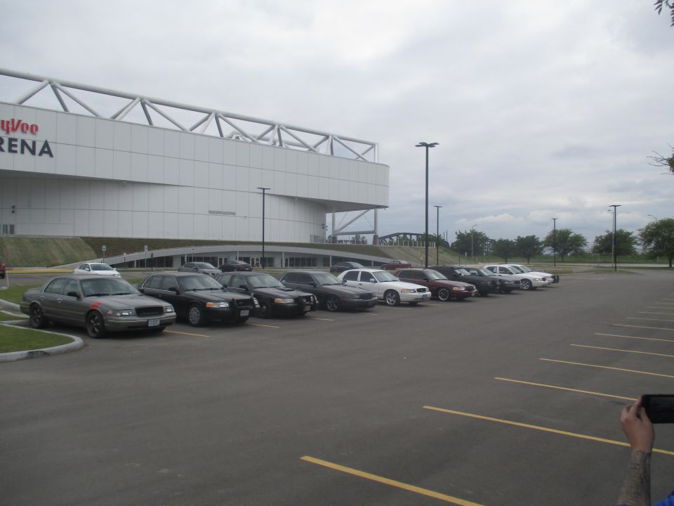 Side view of multiple 2004 Ford Crown Victorias parked in a lot