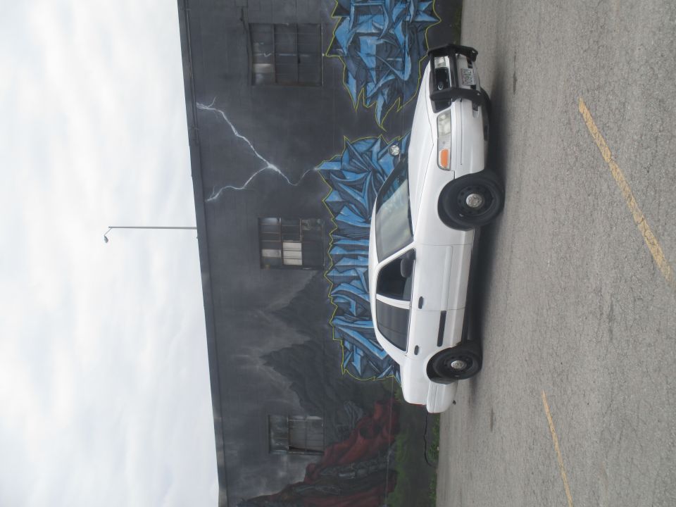 White 2004 Ford Crown Victoria parked curbside