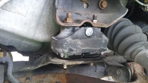 close-up of a vehicle's engine mount and part of the suspension system