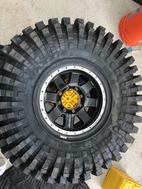 1992 Jeep Wrangler - A close-up of a large, aggressive off-road tire mounted on a custom wheel.