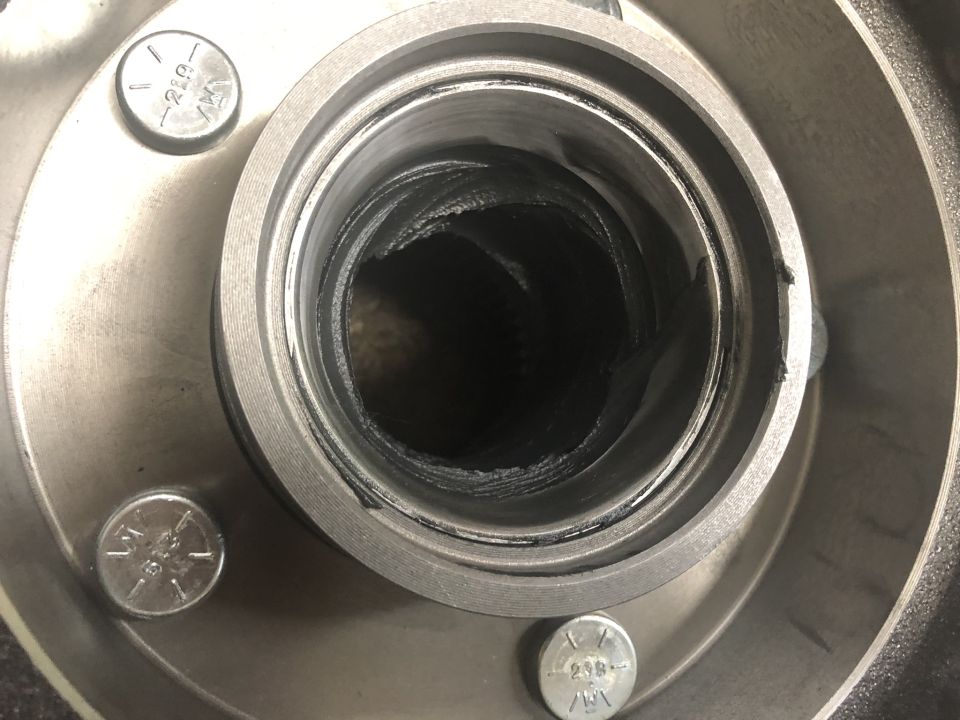 Opinions and methods vary. Personally I like to fill the cavity between the wheel bearings, inside the hub, with fresh grease. Not so much that it would be disturbed when installing the hub assembly onto the spindle, but a good amount spread around on the depressed area inside the hub between both wheel bearings.
