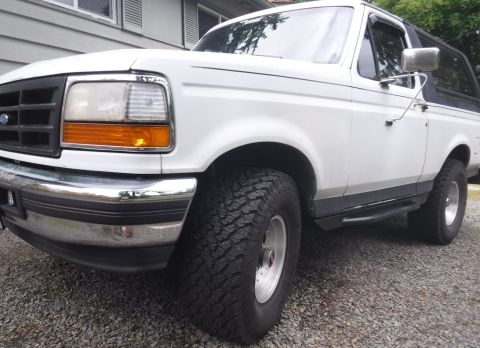1992 Ford Bronco - Custom steps/sliders installed.