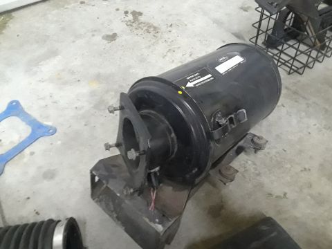 1994 Ford Bronco - Air cleaner assembly with a label that reads "IMPORTANT: ALTERNATIVE AIR INTAKE" and "WWW.SUPERMOTORS.NET" at the bottom.