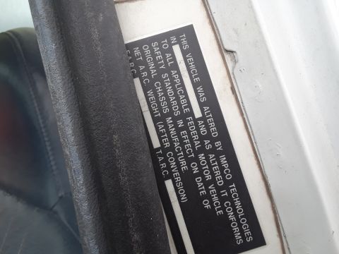 1994 Ford Bronco - This sticker details vehicle alterations and compliance with federal motor vehicle safety standards.