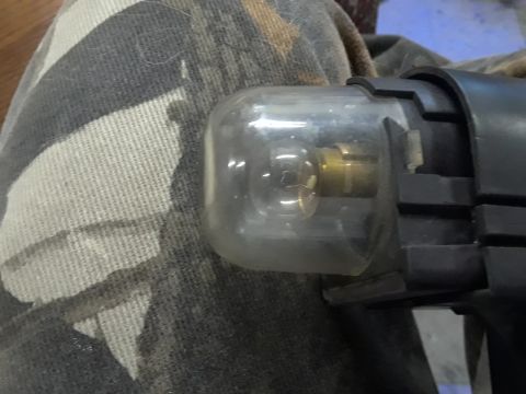 1985 Ford Bronco - This is a close-up view of a fuel filter, showing its clear housing and brass fittings.