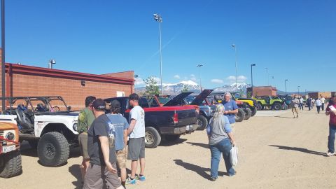 1985 Ford Bronco - Off-road vehicles gathered at an event, with several Jeep CJ-7s prominently displayed.