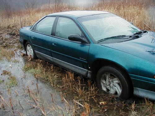 1995 Dodge Intrepid stuck in muddy water, side view