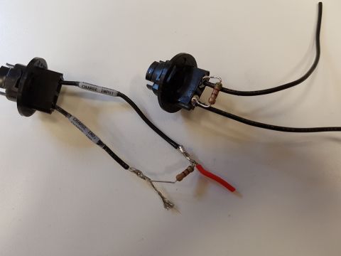 1978 Ford Bronco - Modified electrical connectors with resistors and wires are shown on a white surface.