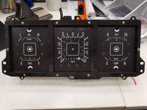 1978 Ford Bronco - A close-up view of a vintage vehicle's instrument cluster, featuring gauges for oil, fuel, speed, voltage, and temperature, along with indi…