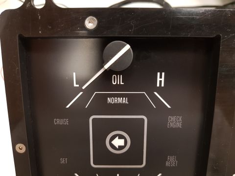 1978 Ford Bronco - A close-up view of an oil pressure gauge in a vehicle. The gauge has markings for 'L' (Low), 'OIL', 'H' (High), and 'NORMAL', with the need…