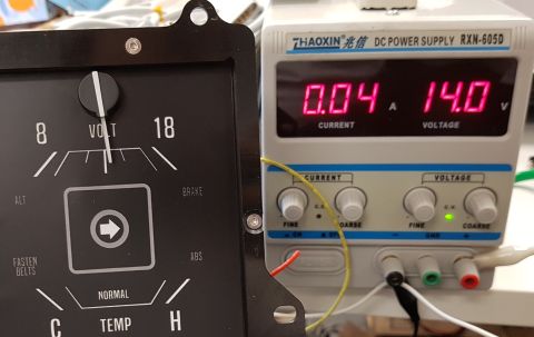 1978 Ford Bronco - A close-up view shows a vintage dashboard gauge cluster next to a DC power supply. The gauge has markings for volts, brake, and temperature…