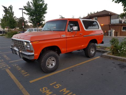 1978 Ford Bronco - This 1978 Ford Bronco is parked in a lot with yellow lines on the asphalt.