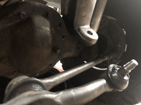 1995 Ford Bronco - This image shows the steering linkage and differential of a vehicle, not a specific model year.