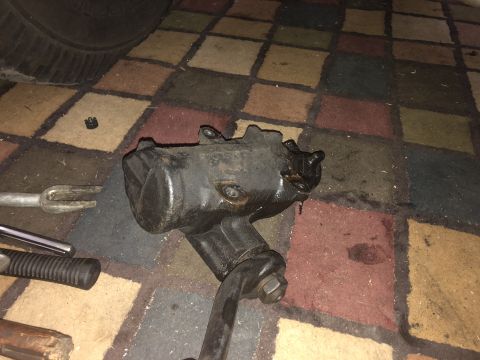 1995 Ford Bronco - A close-up view of a removed steering gear box, likely for repair or replacement.