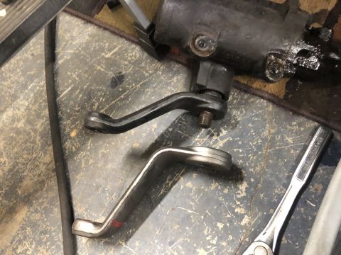 1995 Ford Bronco - A steering gear box and two pitman arms are shown on a workshop floor.