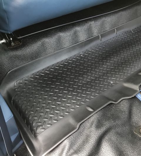 1995 Ford Bronco - Diamond plate floor mat installed in a vehicle's interior, showing the textured surface and surrounding black flooring.