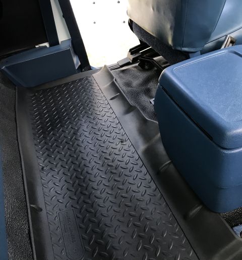 1995 Ford Bronco - Diamond plate floor mats and blue seats are visible inside this vehicle's interior.