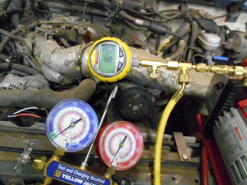 1992 Ford Bronco - AC gauges are connected to the engine for testing and charging.