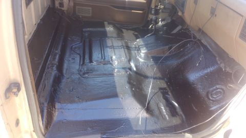 1990 Ford F-250 - The interior of a 1990 Ford F-250 shows the floor after being treated with black undercoating.